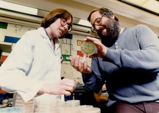 Free to research: Barry Glickman explains a point to laboratory technician Fran Allen