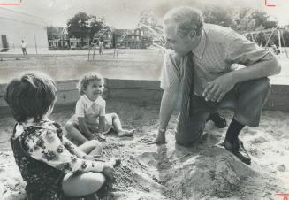 Seymour Gold consults toddlers in a sandbox at Bellwoods Park yesterday and concludes Toronto parks are magnificent.