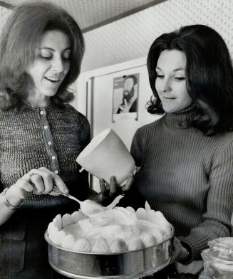 Mrs. M. R. Goldhar, left, and Mrs. L. S. Walter made dessert, Buffet dish is colorful, attractive and good to eat