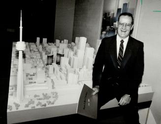 Winning clients: Edmund Gosse, Sun Life's Canadian property manager, sits beside a $30,000 model of Toronto, used to help sell his company's office towers to potential tenants