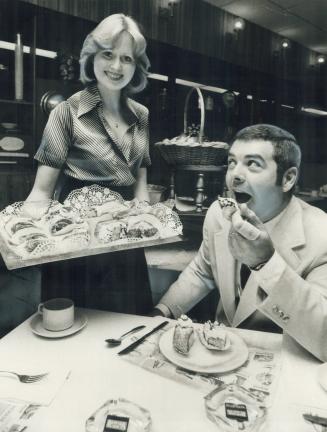 It's been a tough battle for former Mountie Chuck Gouett to lose 30 pounds in weight, so at the victory feast yesterday he indulged in a couple of pastries served by Anna Teitsson