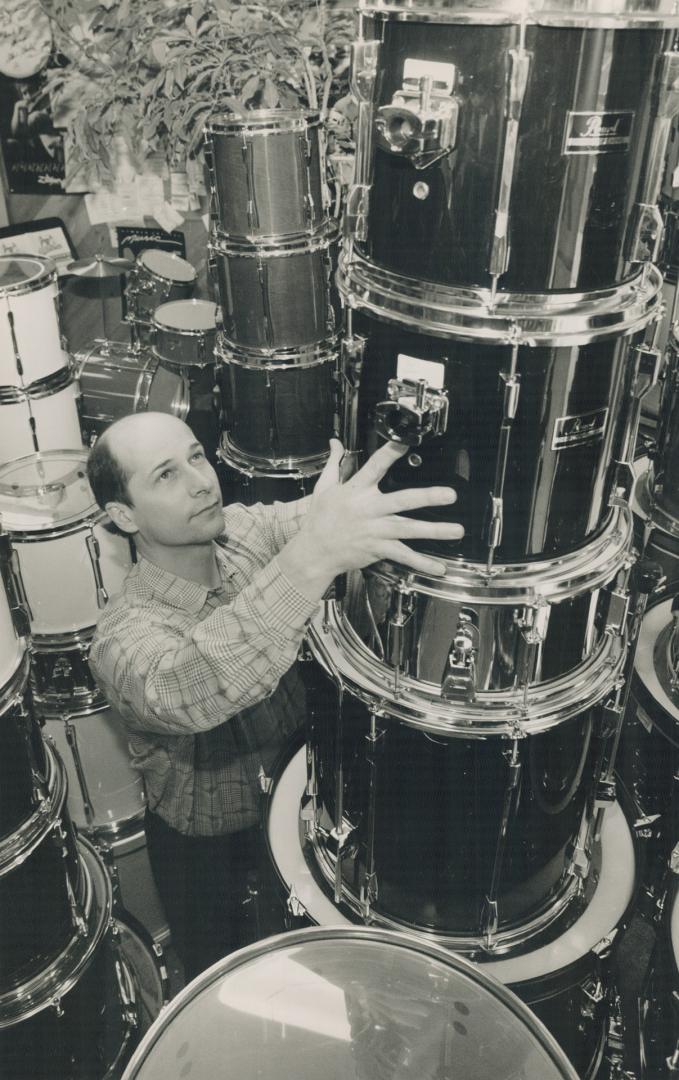 Drumming up Business, Dave Gusple rearranges stockpiles of drums in his store, Just Drums, on Yonge St., south of Finch Ave.