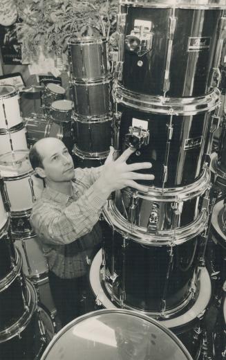 Drumming up Business, Dave Gusple rearranges stockpiles of drums in his store, Just Drums, on Yonge St., south of Finch Ave.