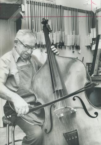 Violin maker George Heinl, 85, plays the only bass he ever made and which is now in the museum of the Church St