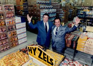 Stack 'emhigh: Hy Himmel, left, and Sel Goldstein stand in their first supermarket drug store, opened seven years ago in Mississauga