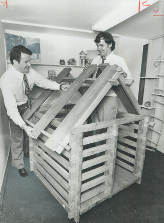 The house that horst built can be assembled and taken apart by children. Horst Henke, the designer, is shown, left, with his assistant Tim Godfrey.