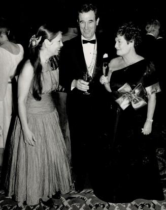 Above left, ball chairman Wendy Cecil-Cockwell with the Empire Club's president, Ronald Goodall, and a past president, Nona Macdonald.