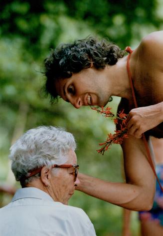 Wilderness fun: Steven Gottlieb, founder and executive director of Boundless Adventures, puts wildflowers in Eileen Johnstone's hair during a recent white-water outing