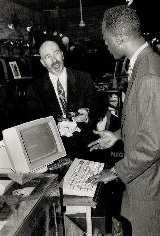 All Ready: Toronto retailer Alan Goouch has computers and software in place that will automatically calculate the new federal sales tax and Ontario sales tax on goods sold at his four clothing stores