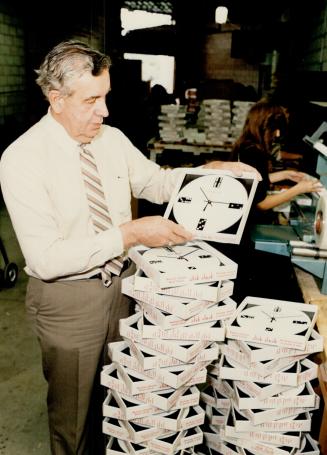 Plastic clock is one of items turned out by the firm Harry Graham, 62, started six years ago. It's worth $4 million a year today, he says.