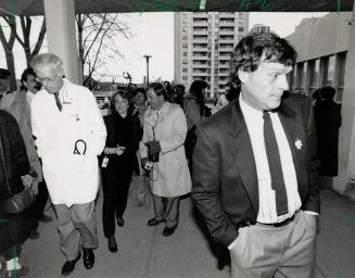 Condition update: Cardiologist Dr. Anthony Graham, left, and Bill enter Wellesley Hospital following a press briefing on Harold Ballard's condition yesterday. Ballard, 86, is on life support systems in intensive care.