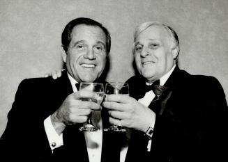 The toast of the town: American comedian Alan King (left) toasts Canadian entertainment mogul Harold Greenberg at the Sheraton Centre last night