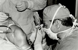 Pin cushion: With the aid of a $16,000 arthroscopic camera, Dr. Irving Grosfield can perform knee surgery in only 45 minutes on an outpatient basis.