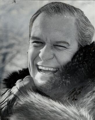 One of the few men in Toronto brave enough to wear a fur coat is stockbroker Wade Hampton, who appears at the office on especially cold days in a raccoon coat