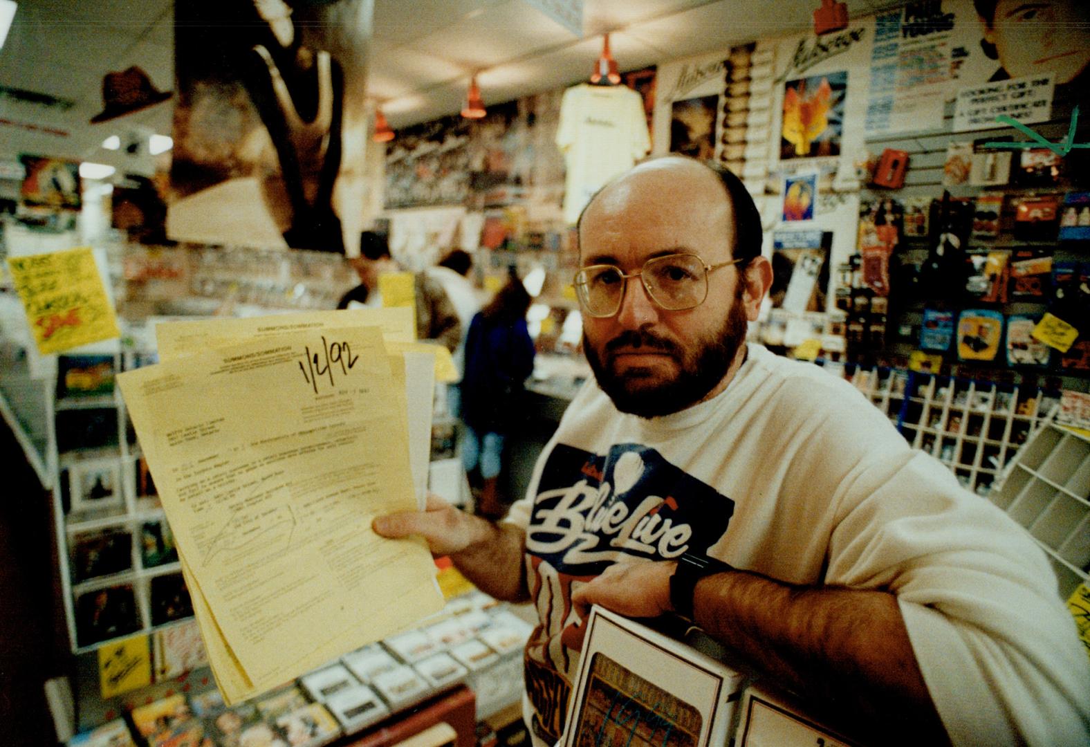 Sour note: North York record store owner Marty Herzog, who was charged for being open yesterday, already has a sheaf of summonses for the same offence