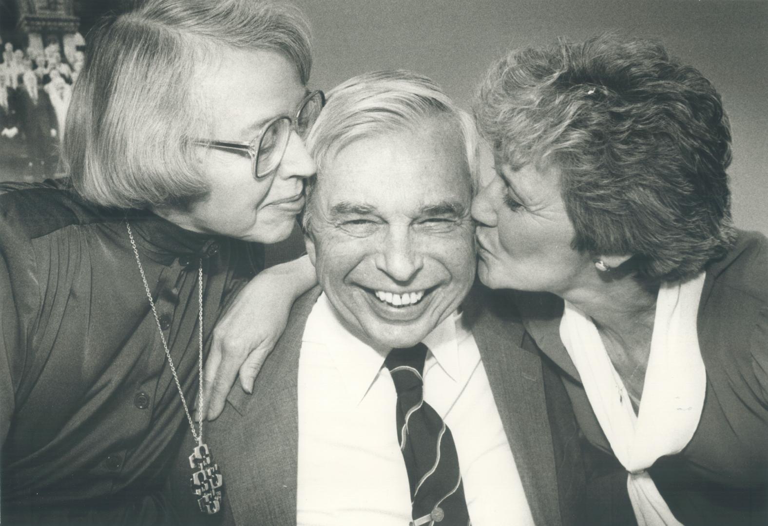 Kisses goodbye: Retiring as Metro solicitor after 33 years, Alex Joy gets a friendly send off yesterday from Winnifred Coatsworth (left), his former secretary for 23 years, and Murdina Strutt, who took her place when she retired two years ago