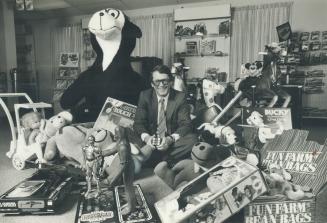 George Irwin is surrounded by a very small part of Christmas '80 edition of the multi-million-dollar annual toy and game bonanza.