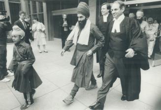 Tejinder Singh Kaloe, 36 (left), a Hamilton businessman described as a lieutenant in the Babbar Khalsa, leaves a Hamilton court with lawyer Clayton Ruby beside him
