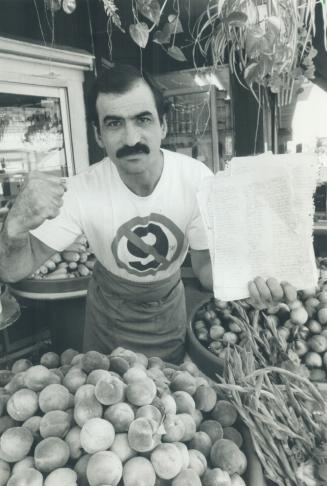 Mad as hell: Greengrocer Gus Karagianis has gathered 3,000 signatures opposing the 9 per cent tax