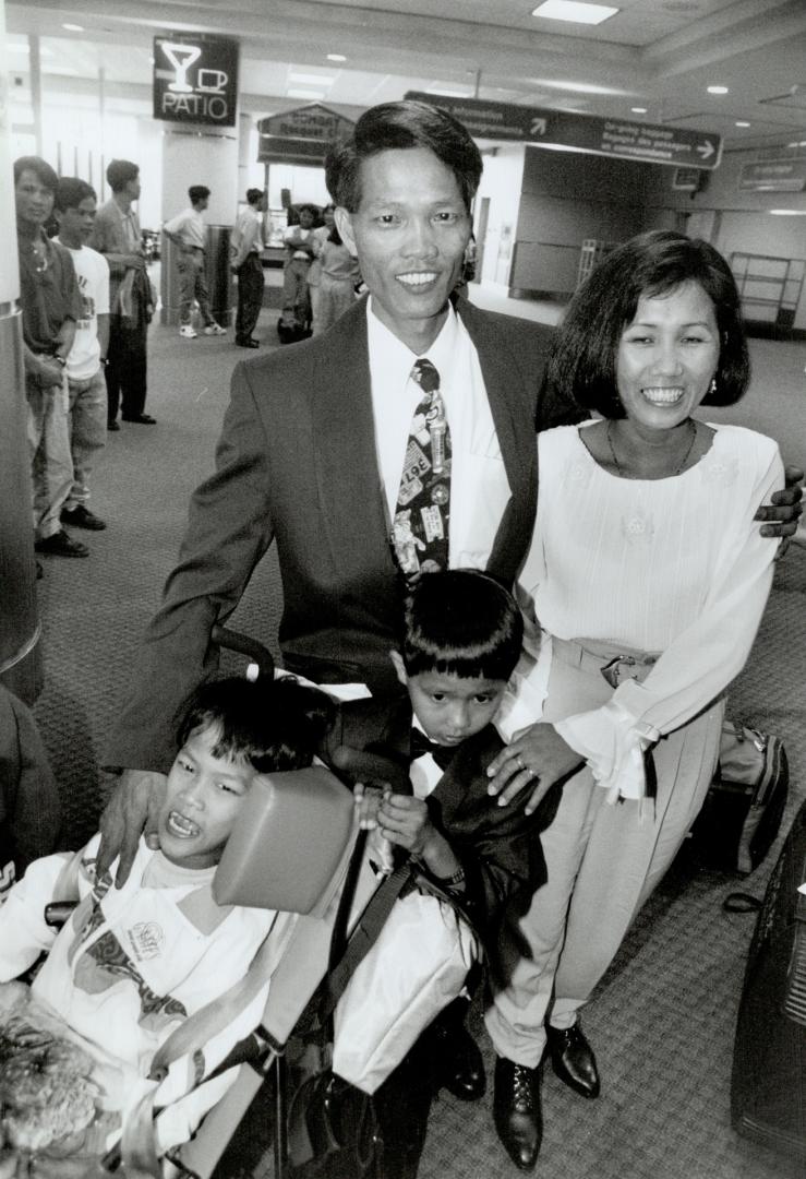 Hoang Hung greets wife Chiev Thi Be and sons Hoang Neoc Thien and Hoang Ngoc Bach