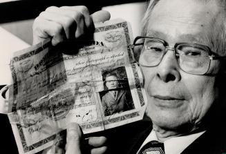 Bitter Memories: Cecil Ing shows the $500 certificate he bought to enter Canada