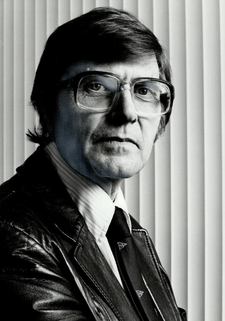 Fooling mother nature: Robert Garvin, vice-president and research chief of Cangene, a Mississauga biotechnology film, stands before a DNA synthesizer machine being used to help delve into the mysterious world of genetic engineering