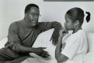Hard to take: Ken Jeffers, a community activist who works with youth, says daughter Tanya, 14, told him: One of the things that bothers me is that if I get in trouble with the police, you can't protect me