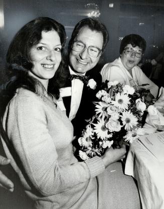 Bouquet of flowers tossed out by Harlequin vice-president Fred Kerner at Toronto's first Harlequin Reader Party, was caught by a non-reader Diane Fontaine, 30, of Hamilton, who attended with a friend