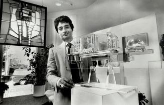 Glass sculpture: Janak Khendry, director of The Glass Art Gallery, with two pieces from his display