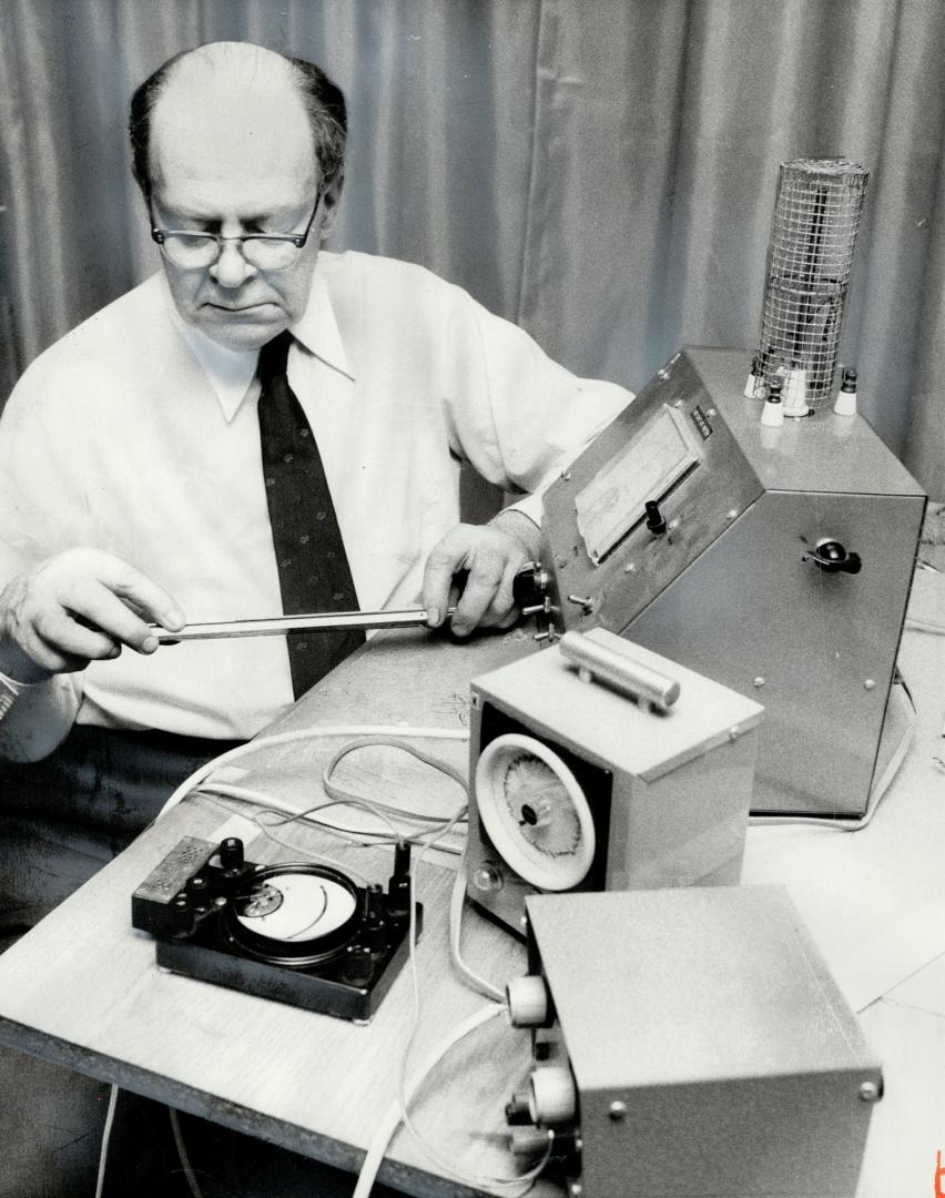 Toronto engineer William Kitchen uses a small ionization generator