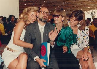 Clothing coup: Steven Levy, surrounded here by models Sharolyn Sparrow, June Round and Janyce Newman, takes the unique approach of surrounding Canada's fashion elite with thousands of customers at the Festival of Canadian Fashion