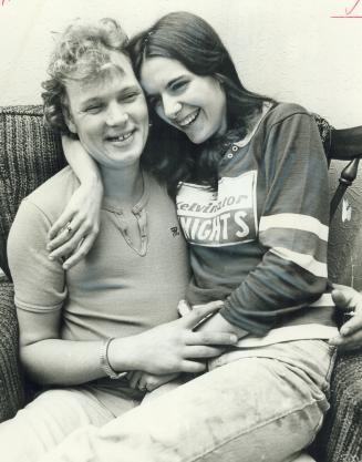 Love is... being out of jail and sitting with your fiancee again. Larry LeBlanc knows that. He has been released after a murder charge was dropped and 19-year-old Donna Welsh was pretty happy about it. Although couple had to postpone their wedding it was great to be free and together again.
