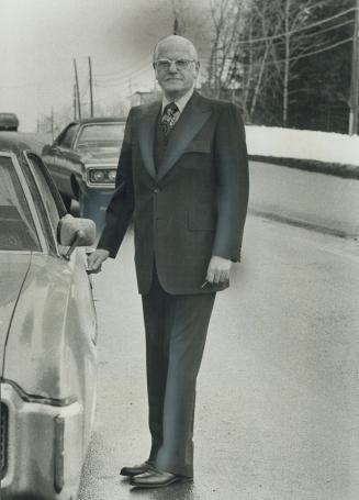 Murray Levine, a director of the federal government's project Fashion Canada, likes brown business suit with blue windowpane check, single breasting, six-button vest and flared trousers