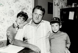 Installed foam: Ingo Koenne of Scarborough says he can only thank God that he and his sons Jason, 9 (left), and Andrew, 7, escaped the more serious health problems caused by urea foam insulation, but the value of his house plummeted