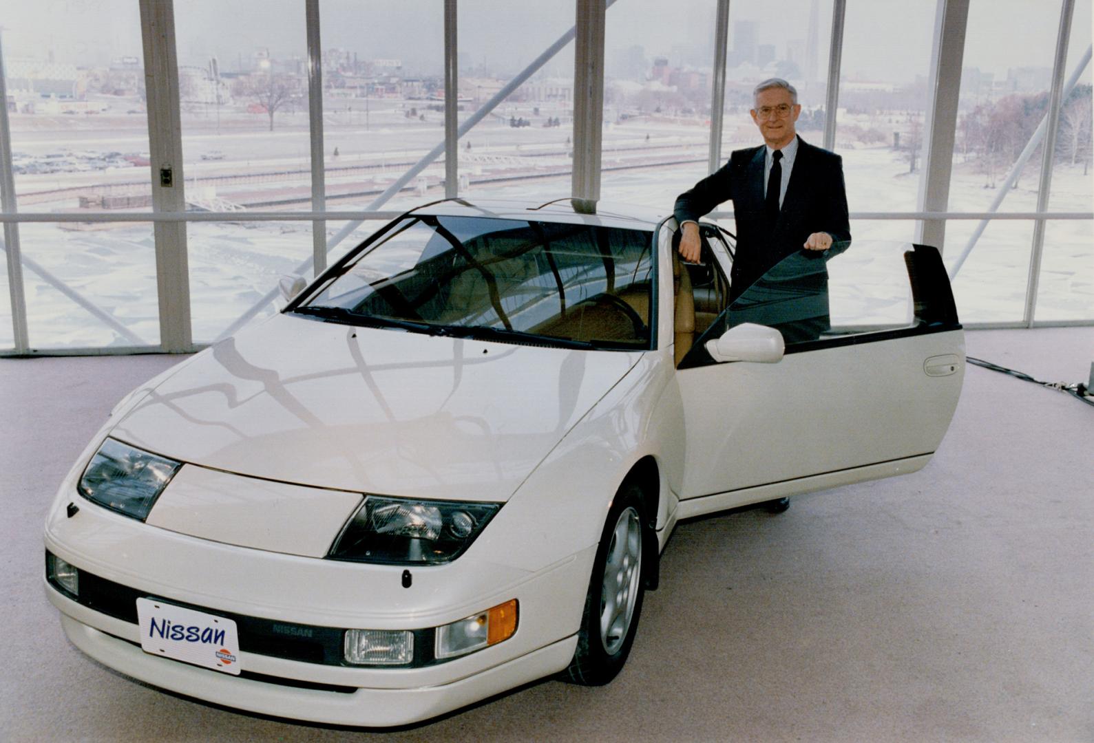 Hot wheels: Gerry Kramer, chairman of Nissan Canada, shows off a prototype of the company's new sports model, the 1990 300ZX