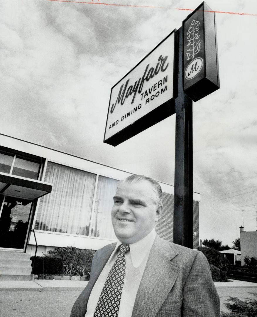 Accused of Nazi war crimes by the Soviet Union, Dmytro Kupiak, standing in front fo the restaurant he owns on the Queensway, is one of four alleged war criminals Moscow is attempting to have extradited from Canada