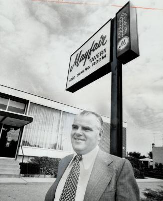 Accused of Nazi war crimes by the Soviet Union, Dmytro Kupiak, standing in front fo the restaurant he owns on the Queensway, is one of four alleged war criminals Moscow is attempting to have extradited from Canada