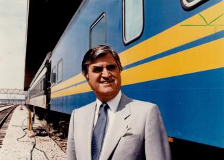 Belt-tighening: CN's president Ronald Lasless stands beside the rail car that serves as his travelling office