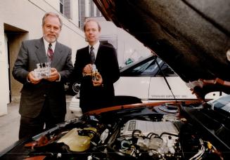 New Idea. Ross Lawford, left, president of Ortech, and Steve Carter, senior consultant, hold the firm's new gaseous fuel injection kit.