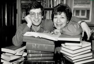Family in law: Michael Loftus and his mother, Vicki, look over law books they studied together on their way to being called to the bar April 14