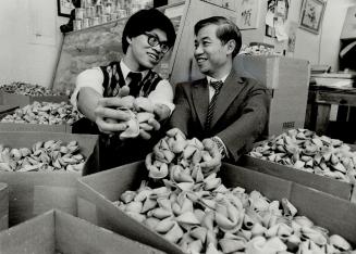 Good fortune: Sunny, right, and Edmond Lee run Far East Food Products of Toronto, a company that makes 120,000 fortune cookies a day.