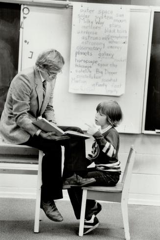 Above: Joel McBurney, 11, with Henry Lise, principal of the 51-student Immanuel Christian School in North York.