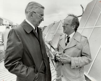 Solar heating system: Ontario Energy Minister Robert Welch, right, chats with Jim Livingstone, president of Imperian Oil, following opening of oil company's solar research project