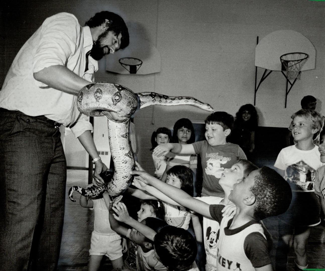 Great Snaks! Jim Lovisek, a reptile expert who works in association with the Royal Ontario Museum, introduces a boa constrictor to pupils at Scarborough's Gooderham Junior Public School