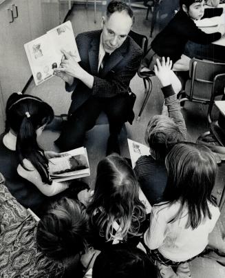 Alfred Luck at the job he's wanted all his life. The former air fordce sergeant and map-maker now teaches small children