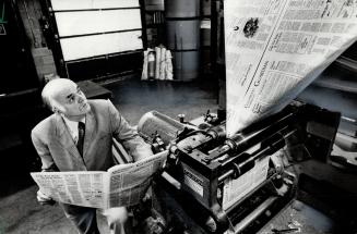 Hot off the press: Kenneth Lyall, editor and publisher of the new Guildwood Guardian, checks copies of the community tabloid as it rolls off the press