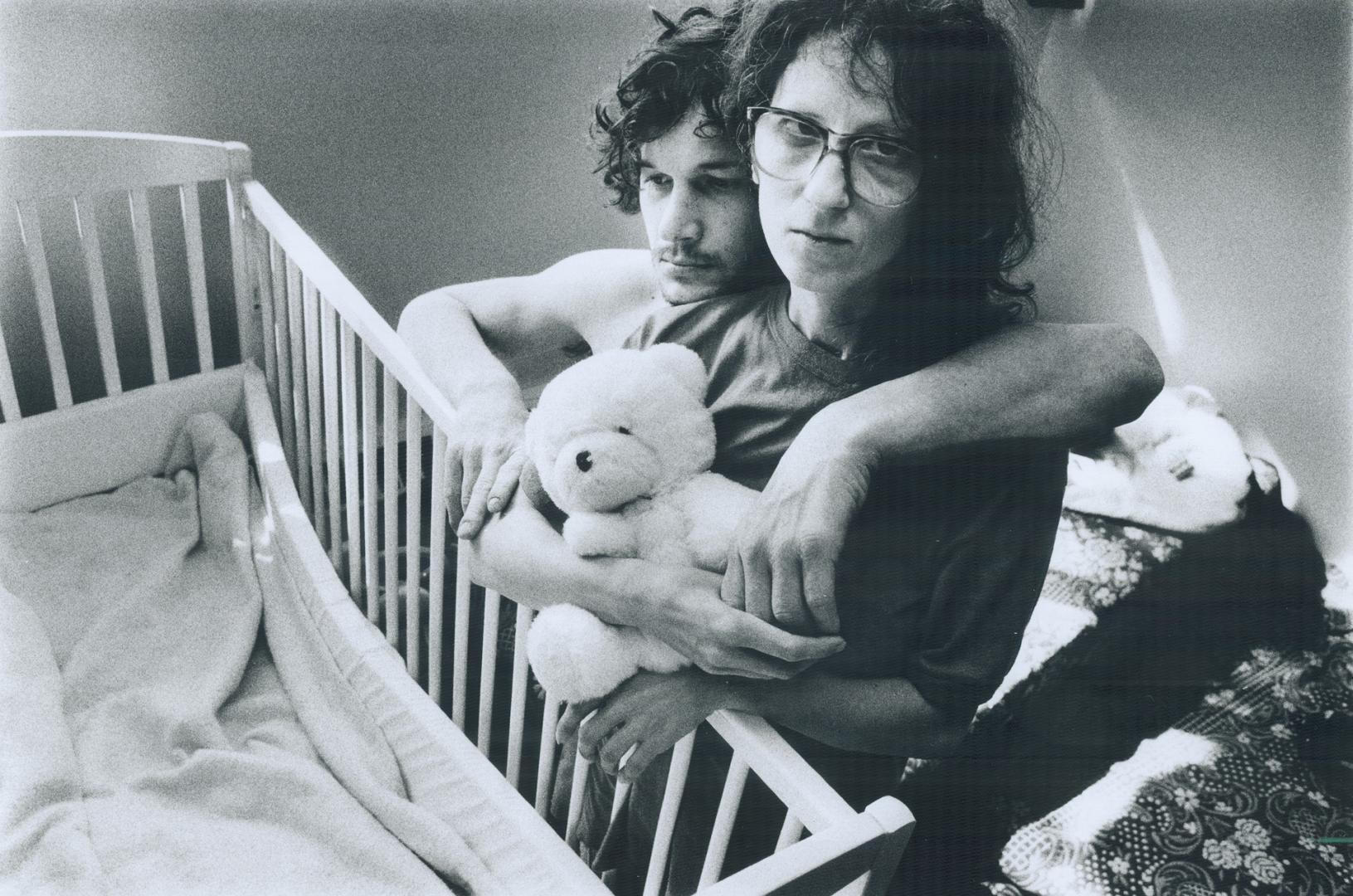 Childless Parents: Kelly McCarthy, who has AIDS, and Patricia Lelli stand in front of their baby's empty crib
