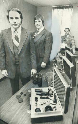 Tools of detective's trade are displayed by former Metro police officer Dan McGarry (right), president of fast-growing Centurion Investigation of Toronto