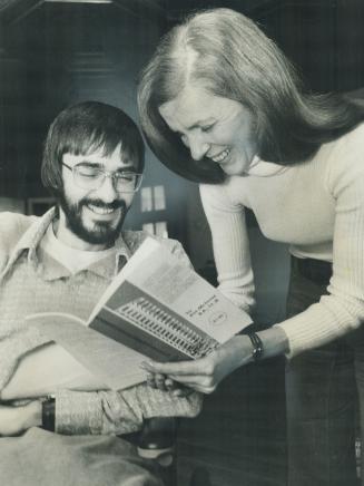 Paralyzed by an automobile accident, lawyer Ronald McInns shows the book he has written on tenants' rights to his physiotherapist, Betty Brooks
