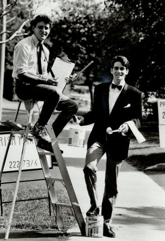Ladder of success: Peter McClusky, 21, at right, and his brother, Michael, 19, discuss their new house-painting business